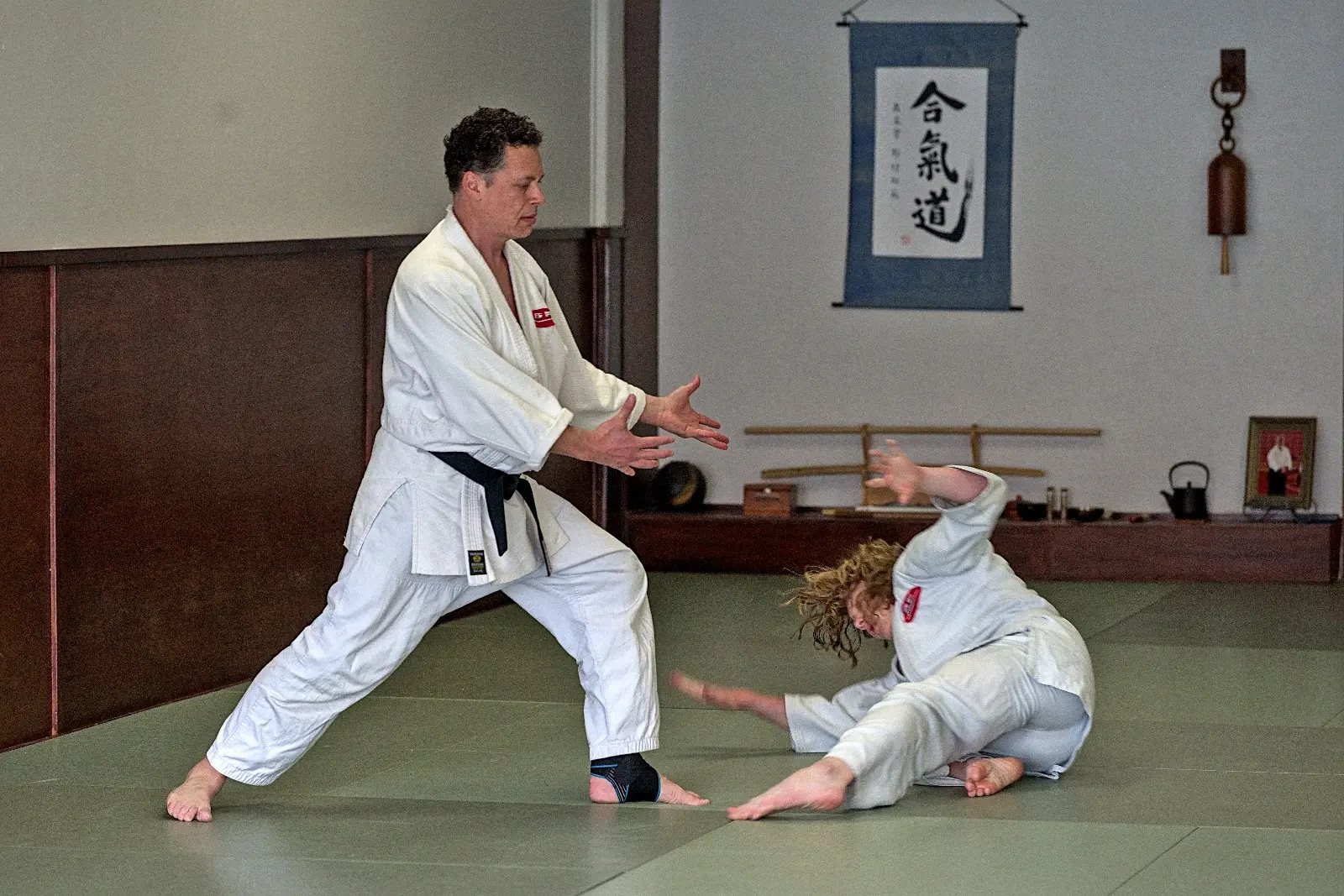 Partnered Aikido practice in the dojo